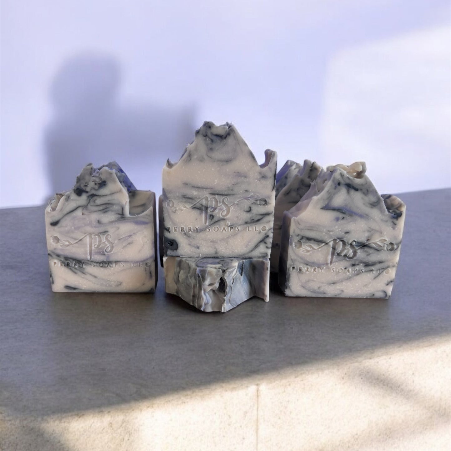 gray soap with black through it