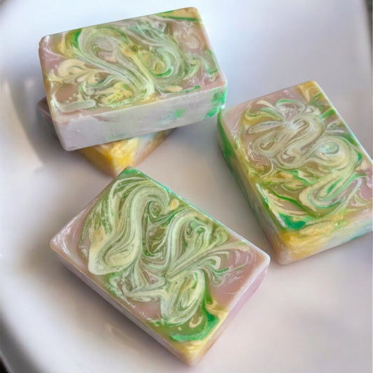 rectangle soap bar light in color with swirls of yellow and green on top