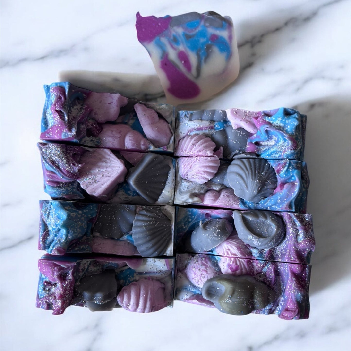 square soaps with seashells on top