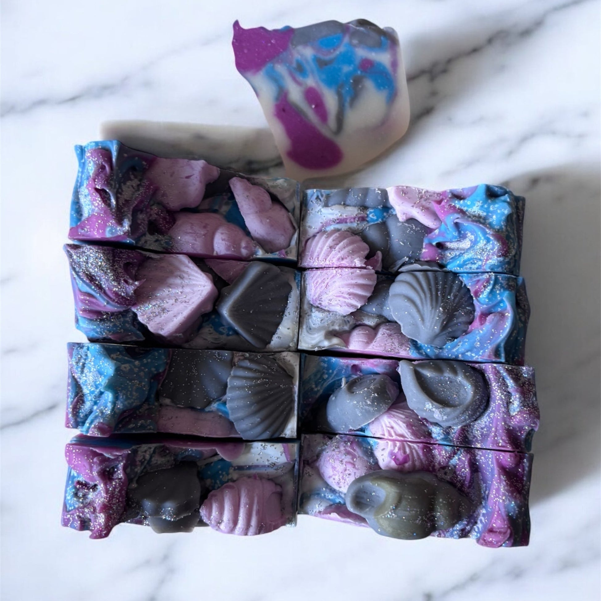 square soaps with seashells on top