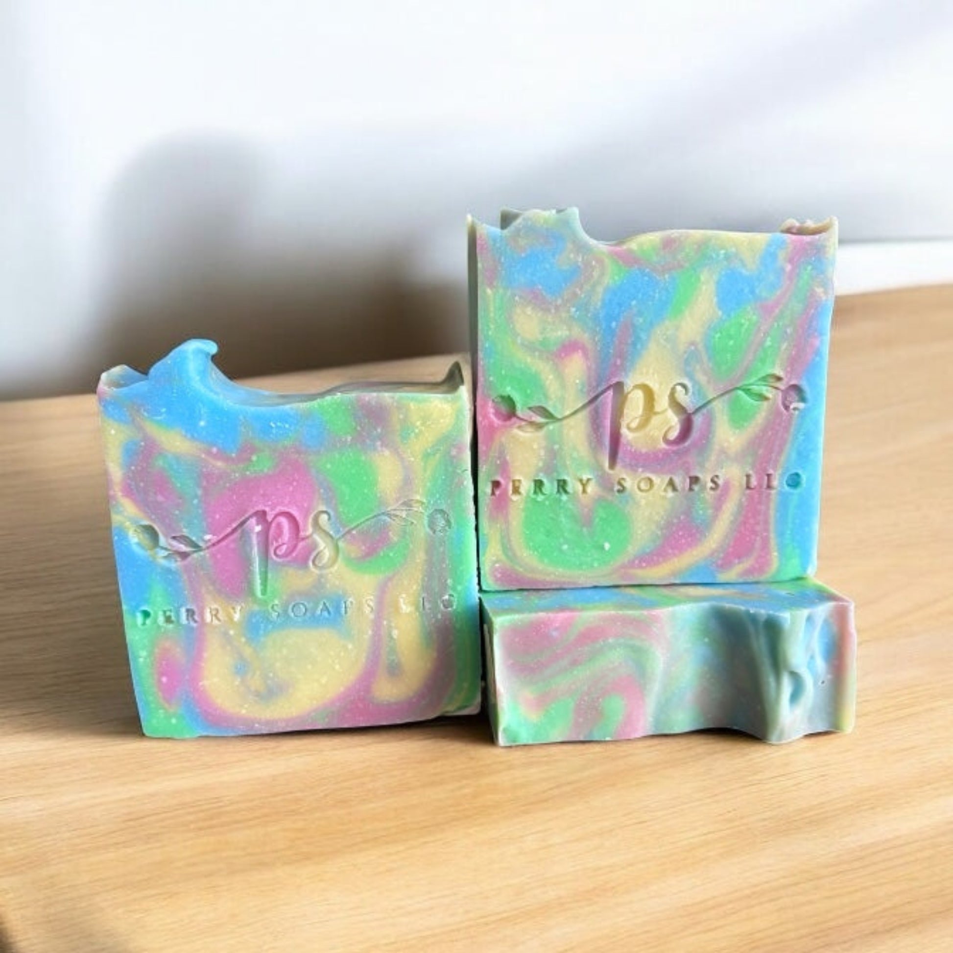 square bar of soap with blue, yellow and light red colors swirled through it