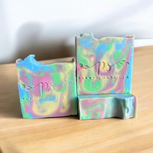 square bar of soap with blue, yellow and light red colors swirled through it